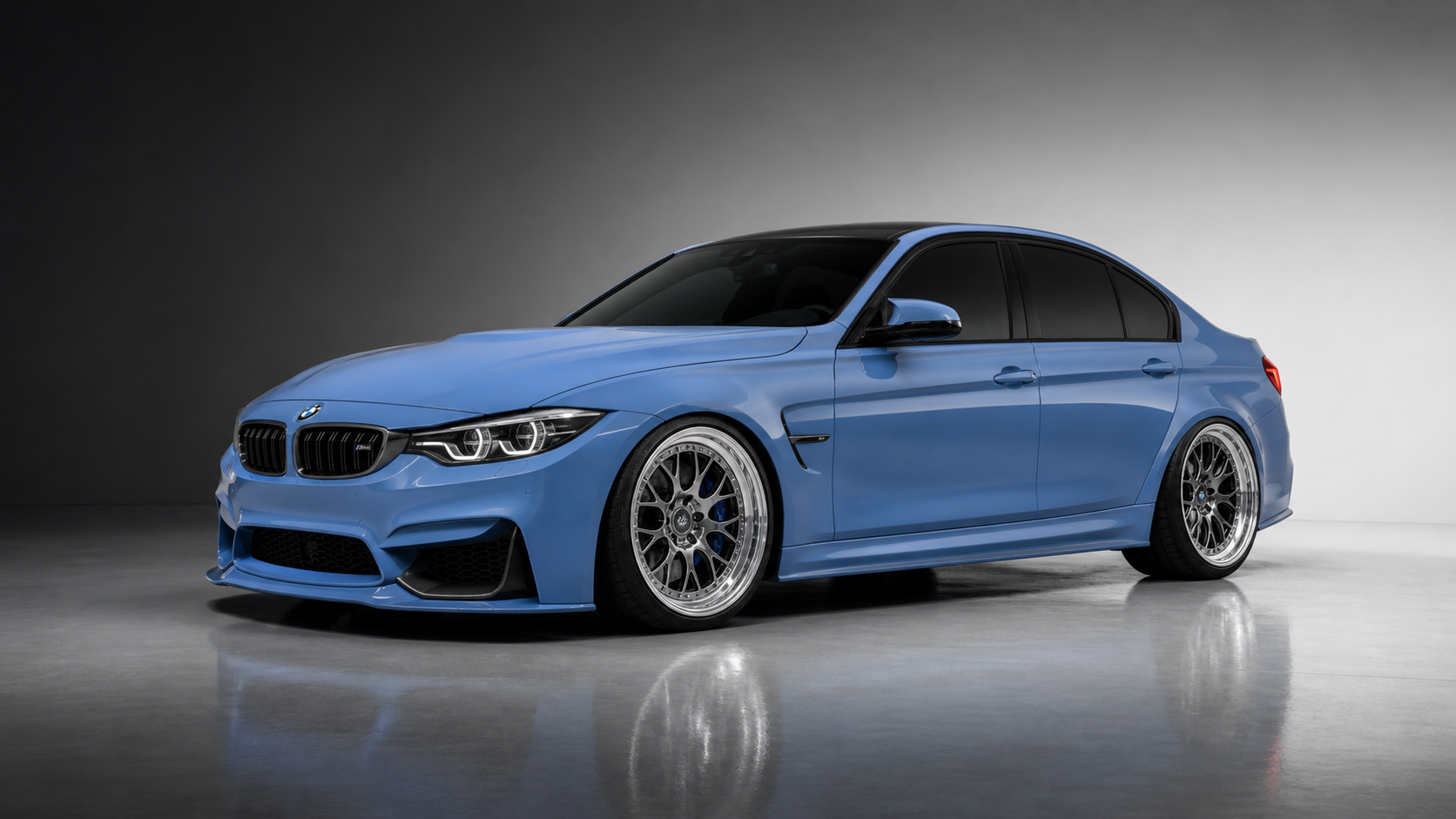 Blue BMW M3 performance build in a studio