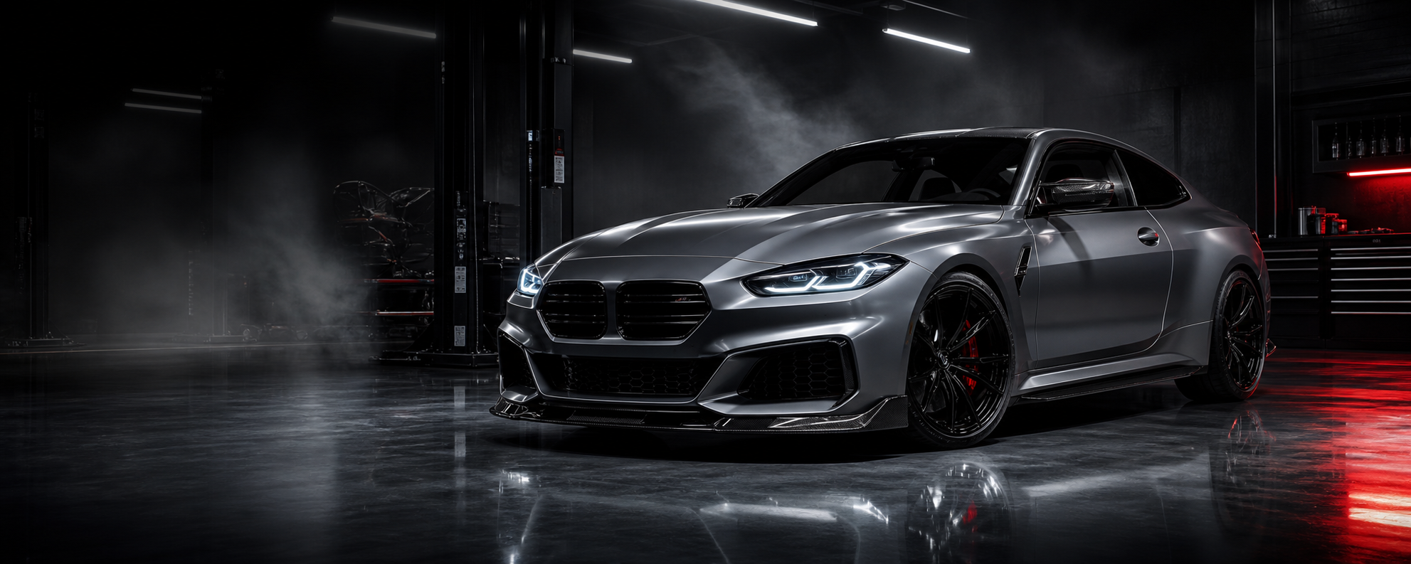 Silver European performance coupe in a dark tuning shop