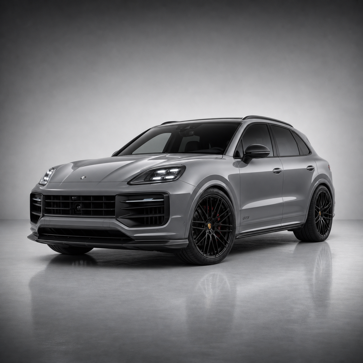 Silver Porsche Cayenne GTS-style SUV in a studio