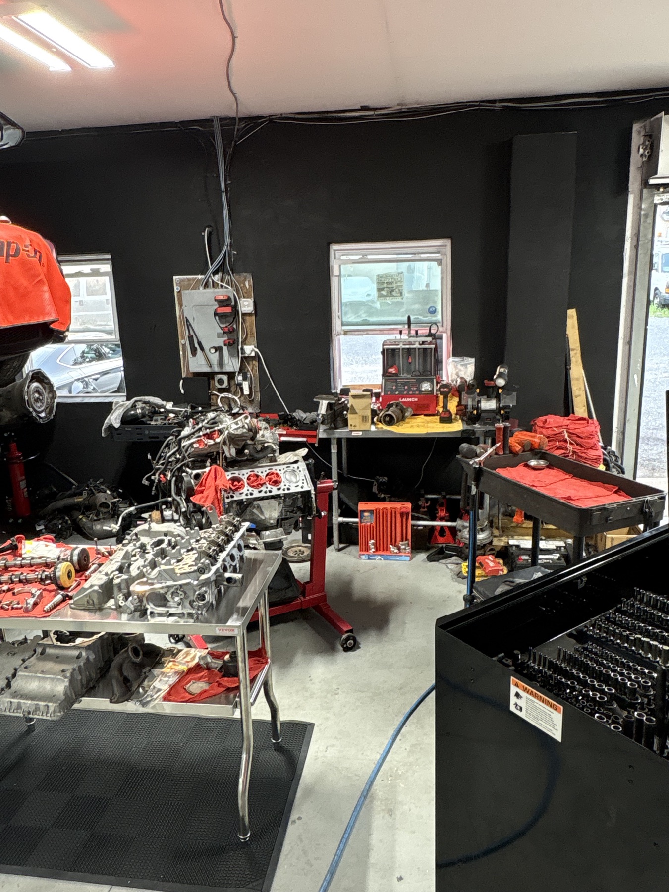 Engine components, tools, and workstations in the build area