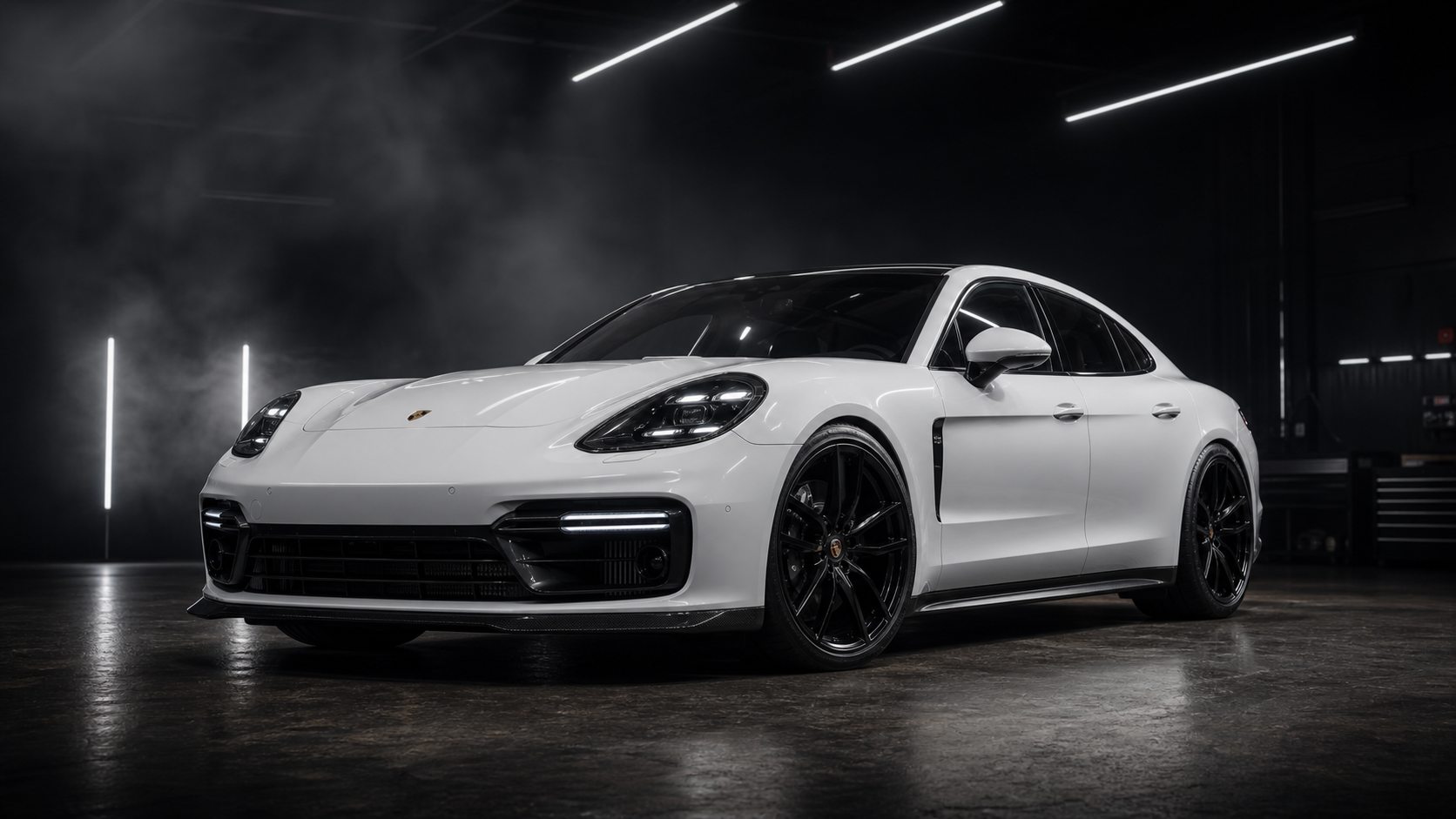 White Porsche Panamera in a dark studio